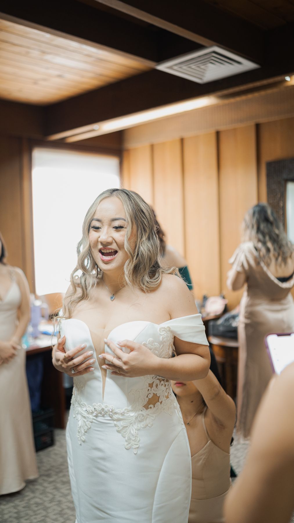Heaven smiling as her friend helps her get ready