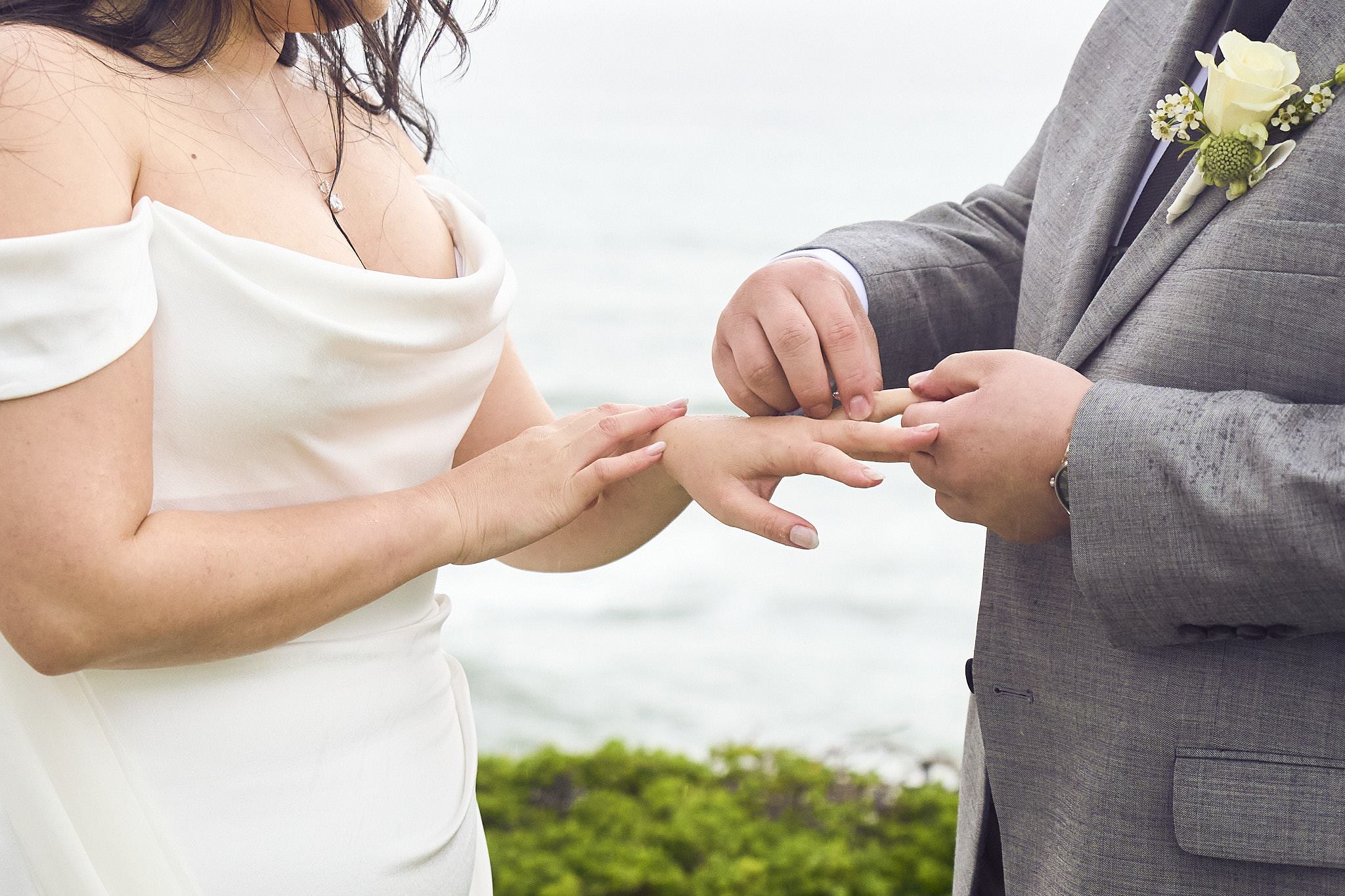 The couple exchanging rings