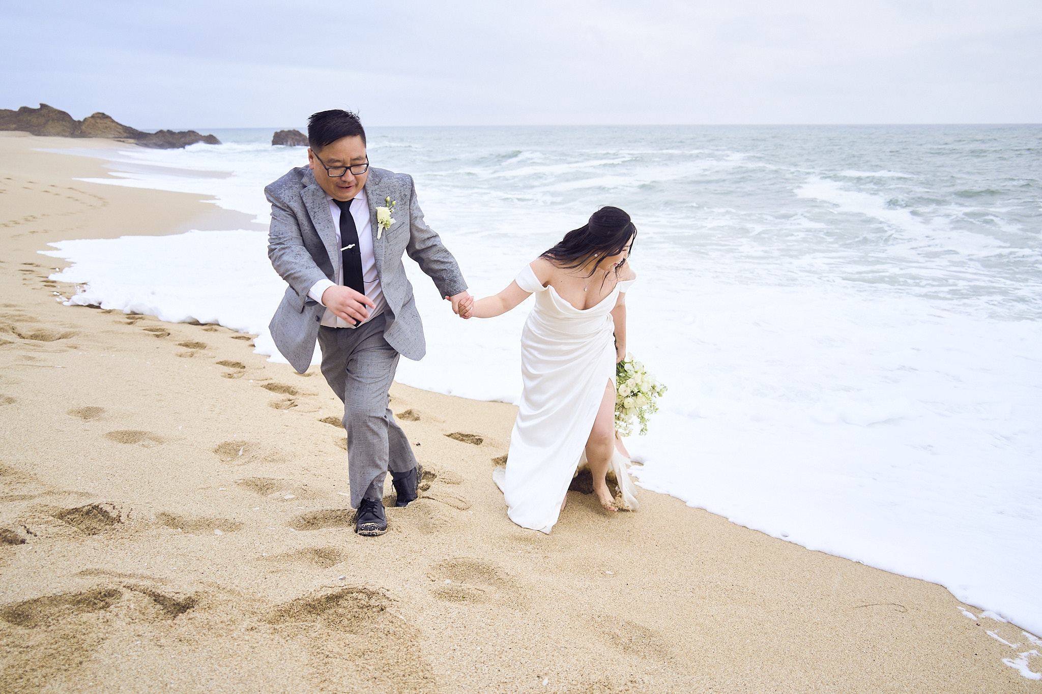 D + C walking together along the beach