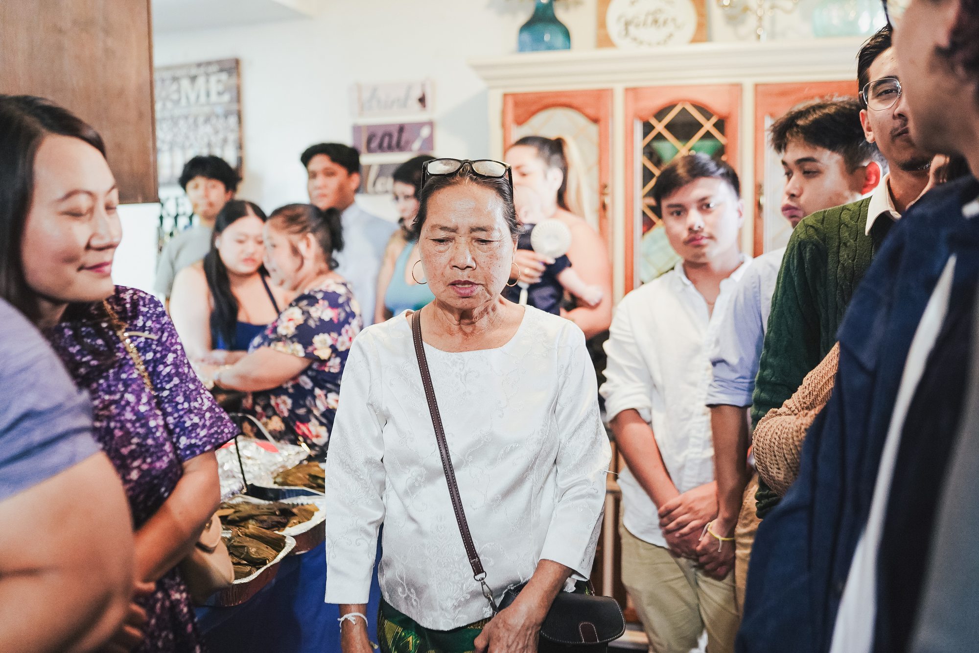 Guests gather as a family elder leads the ceremony