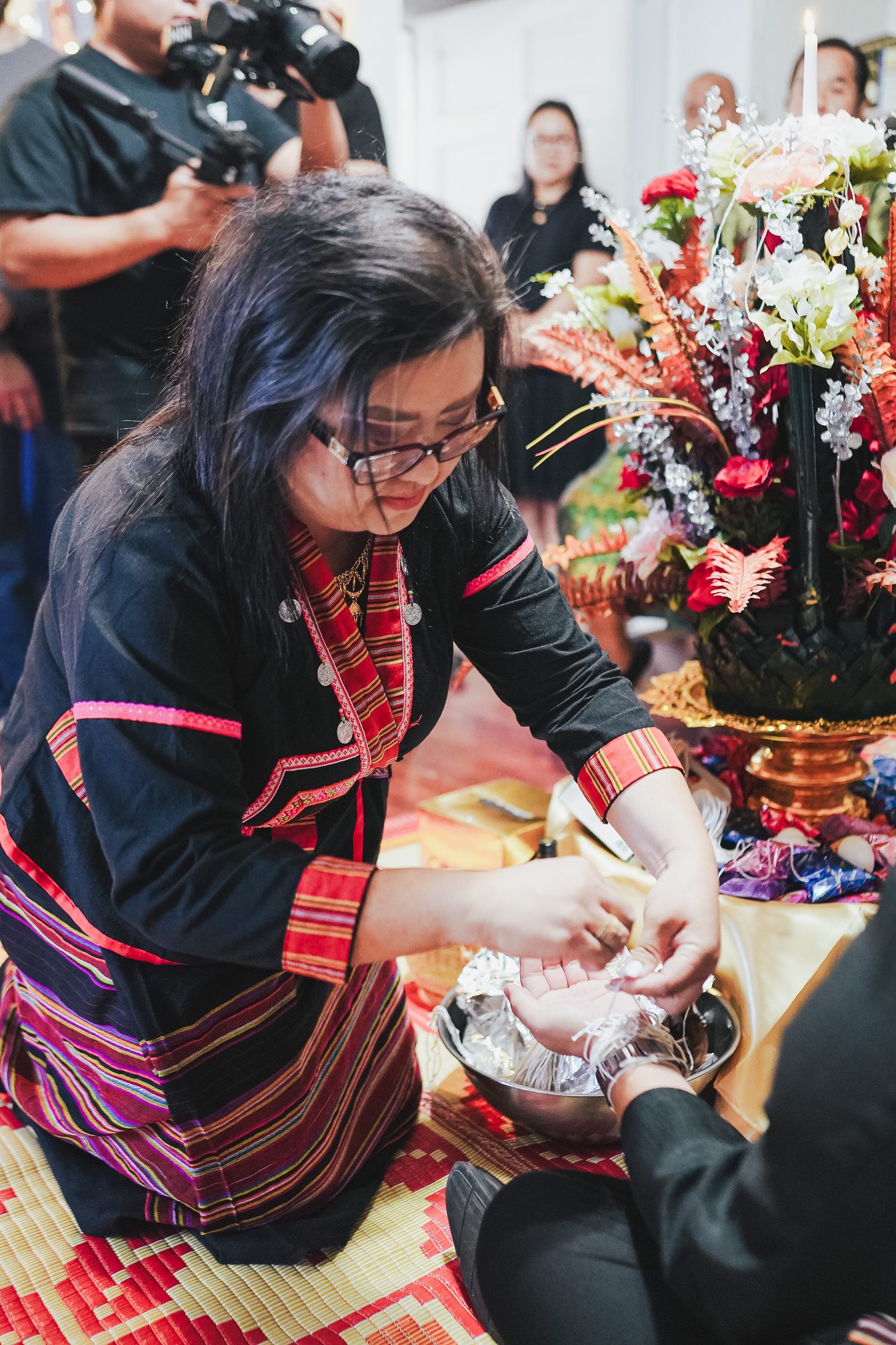 A woman in traditional dress takes part in the ceremony
