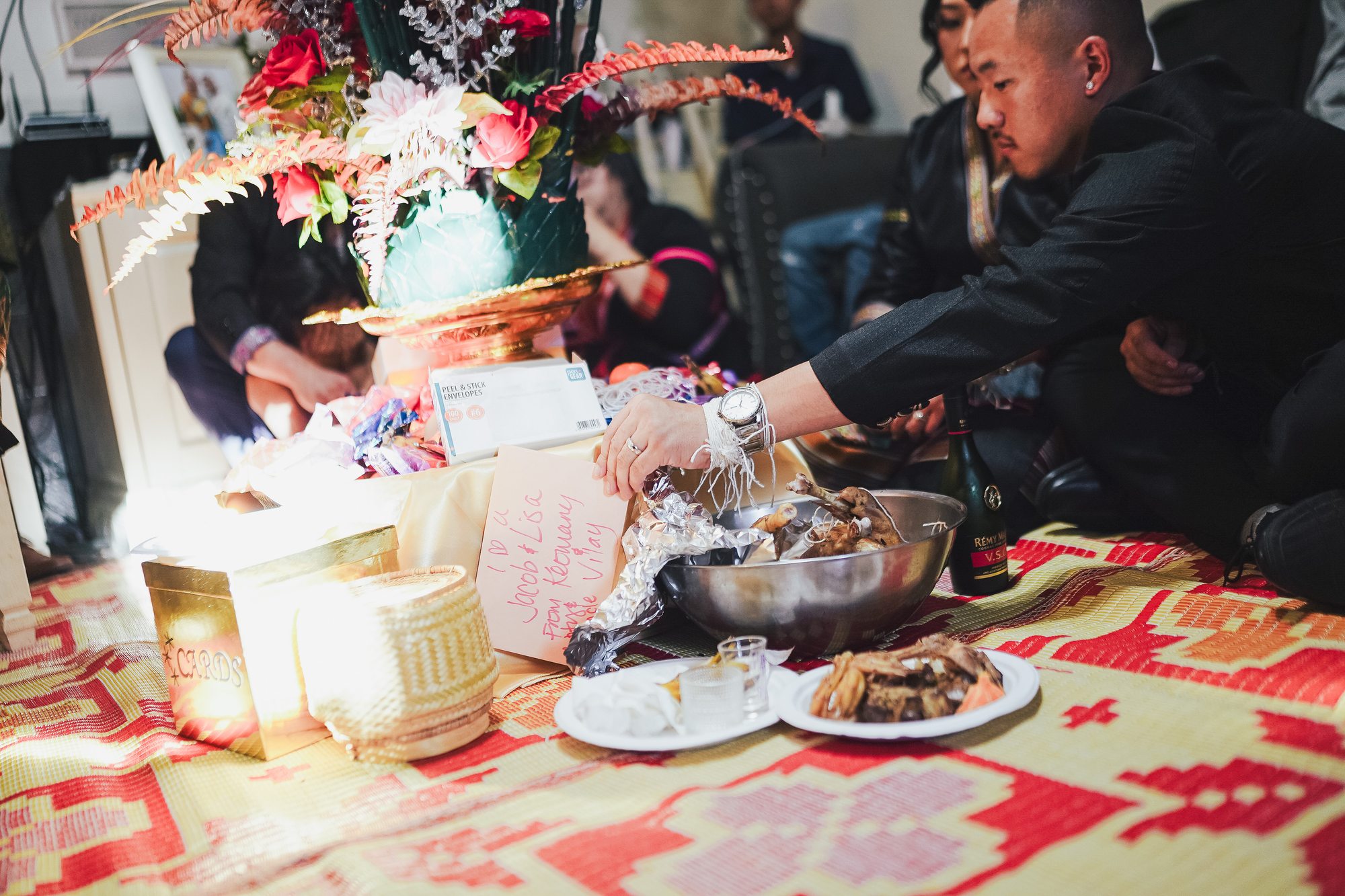 Family members take part in a ceremonial offering